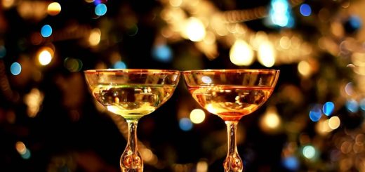 Two Champagne Glasses Over Holiday Bokeh Blinking Background Video Clip